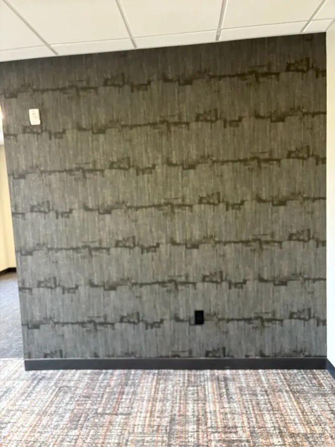 Grey patterned wallcovering on an office wall